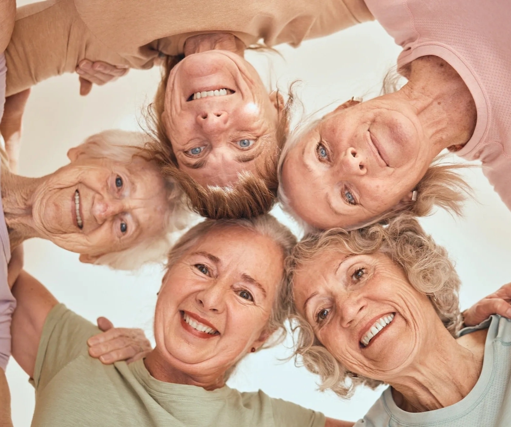 Mature women in a warm group wellness support circle